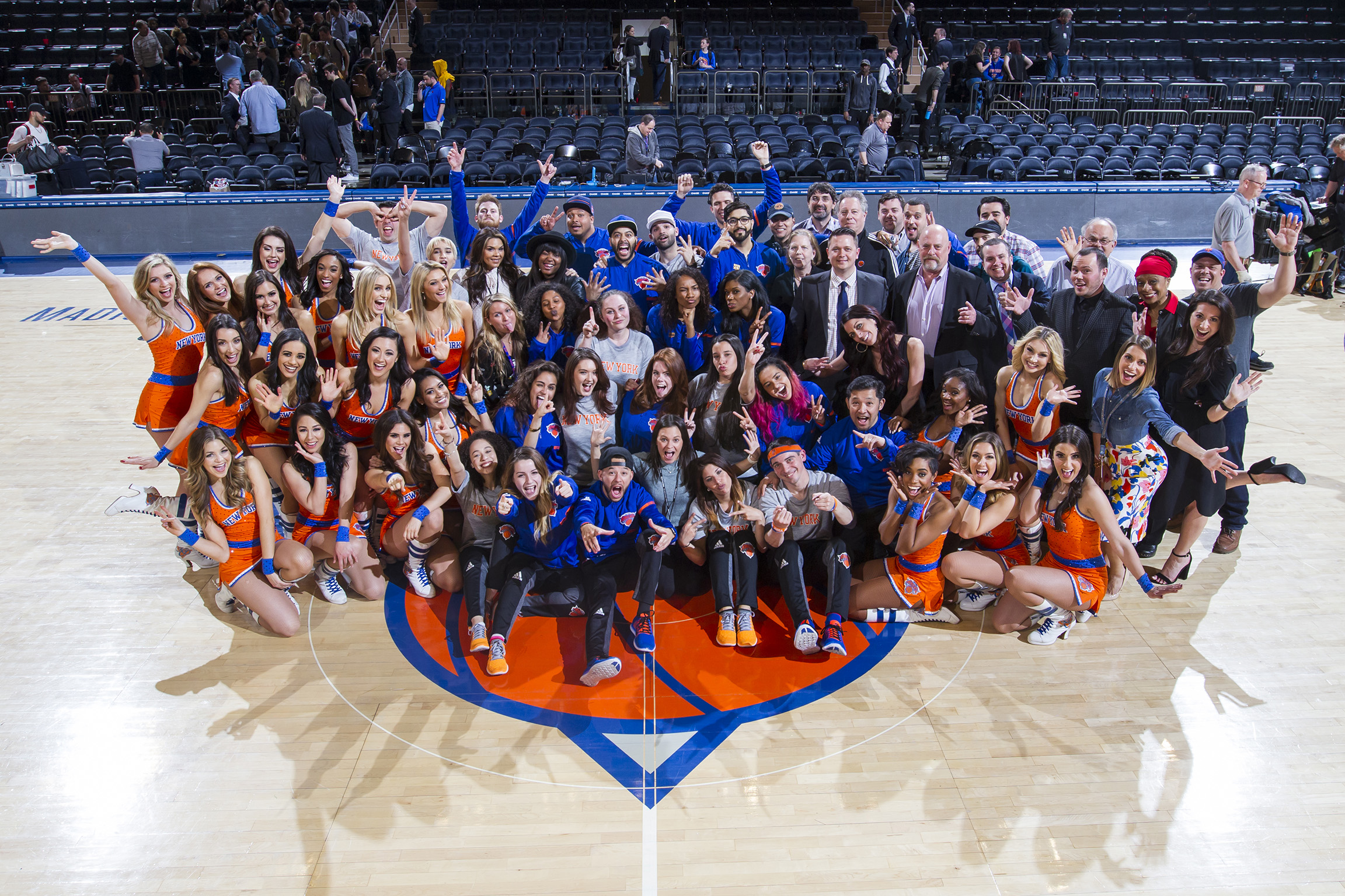 Group photo on the court at Madison Square Garden on a New York Knicks game day.