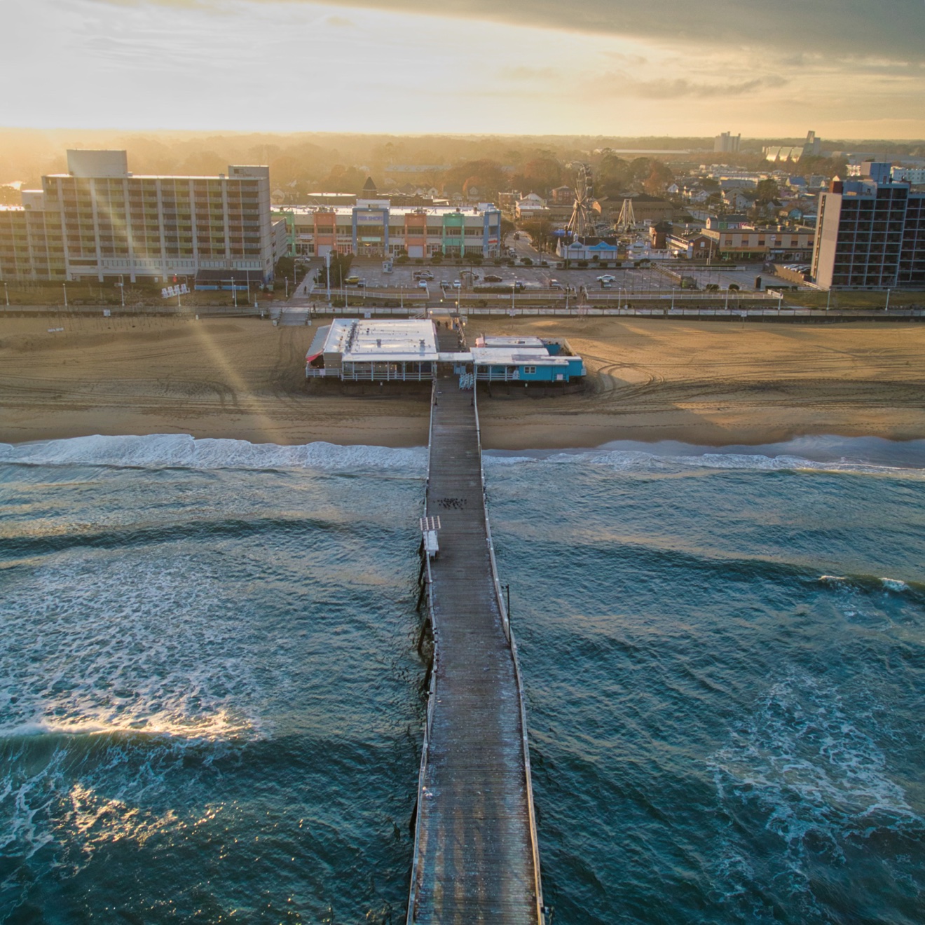 Aerial view of the Virginia Beach oceanfront fishing pier at sunrise