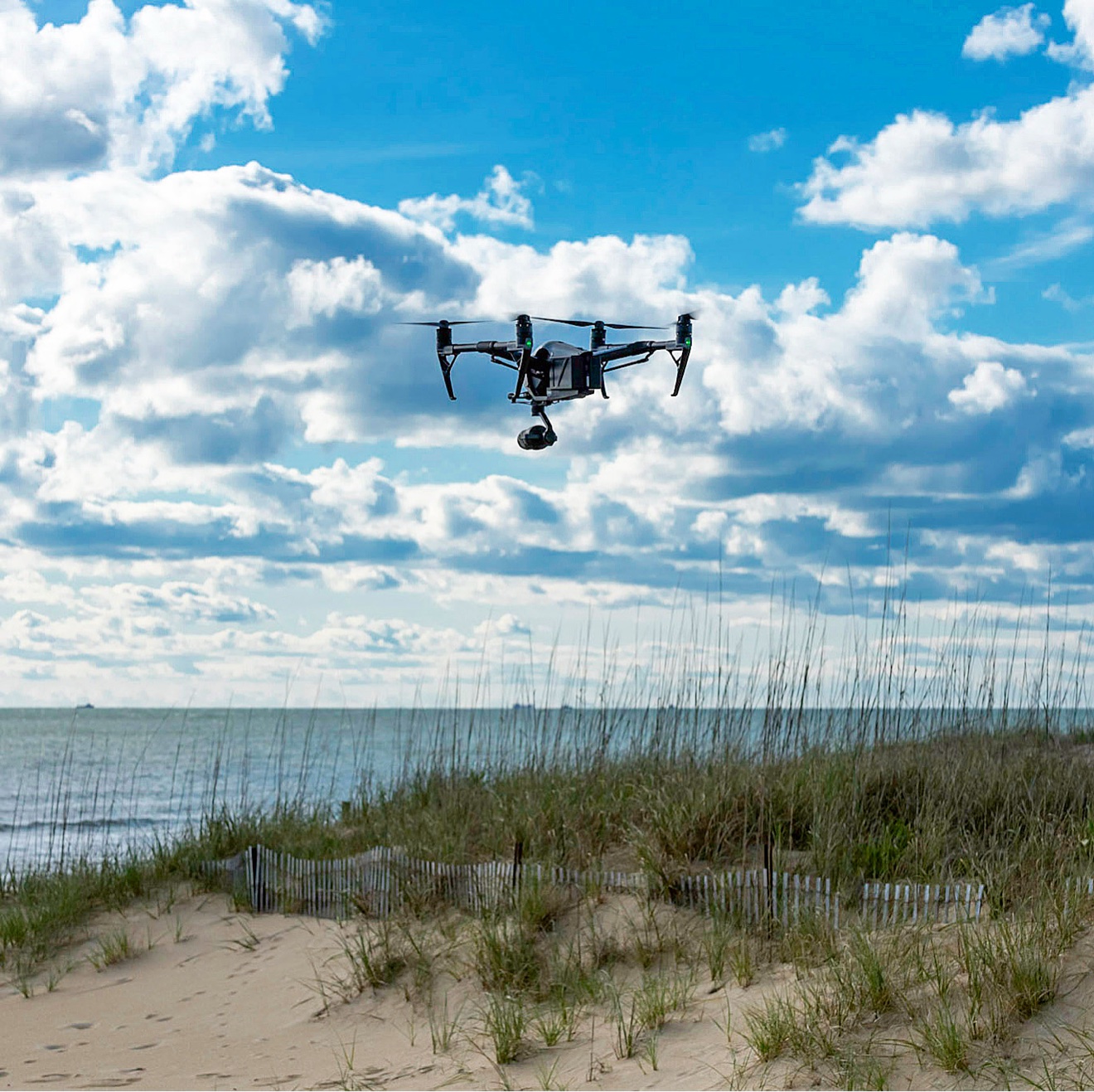 Drone in flight over beach dunes on the Virginia Beach oceanfront
