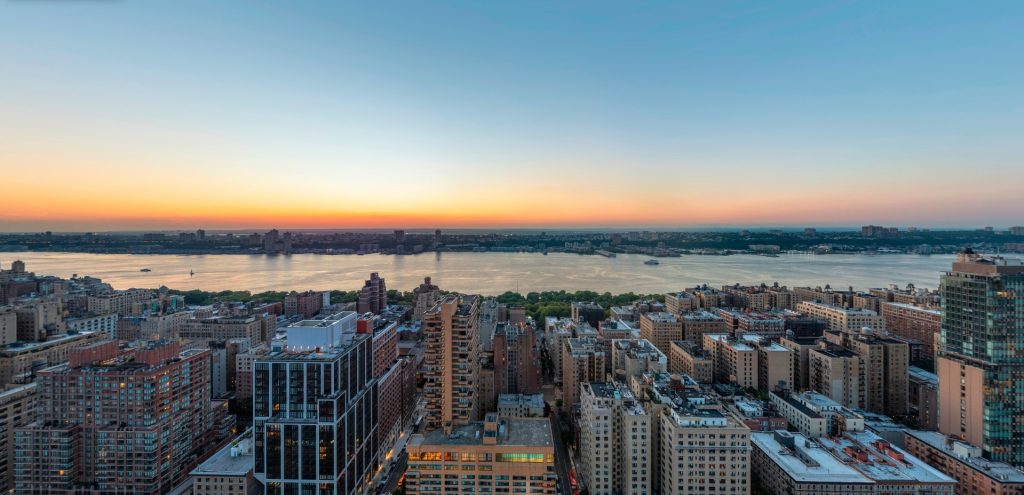 Still from the interactive pano tour for 200 W 97th St, NYC, showing the sunset view over Manhattan toward the Hudson River.
